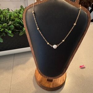 Gold and single pearl necklace